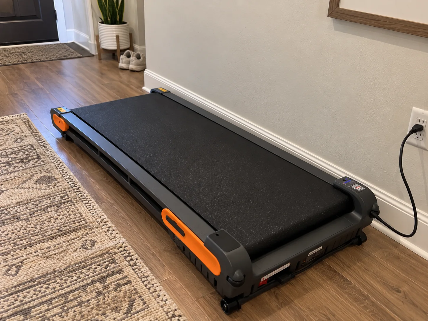 Compact VITALWALK Apollo 11 Vibe-style walking pad in a home interior